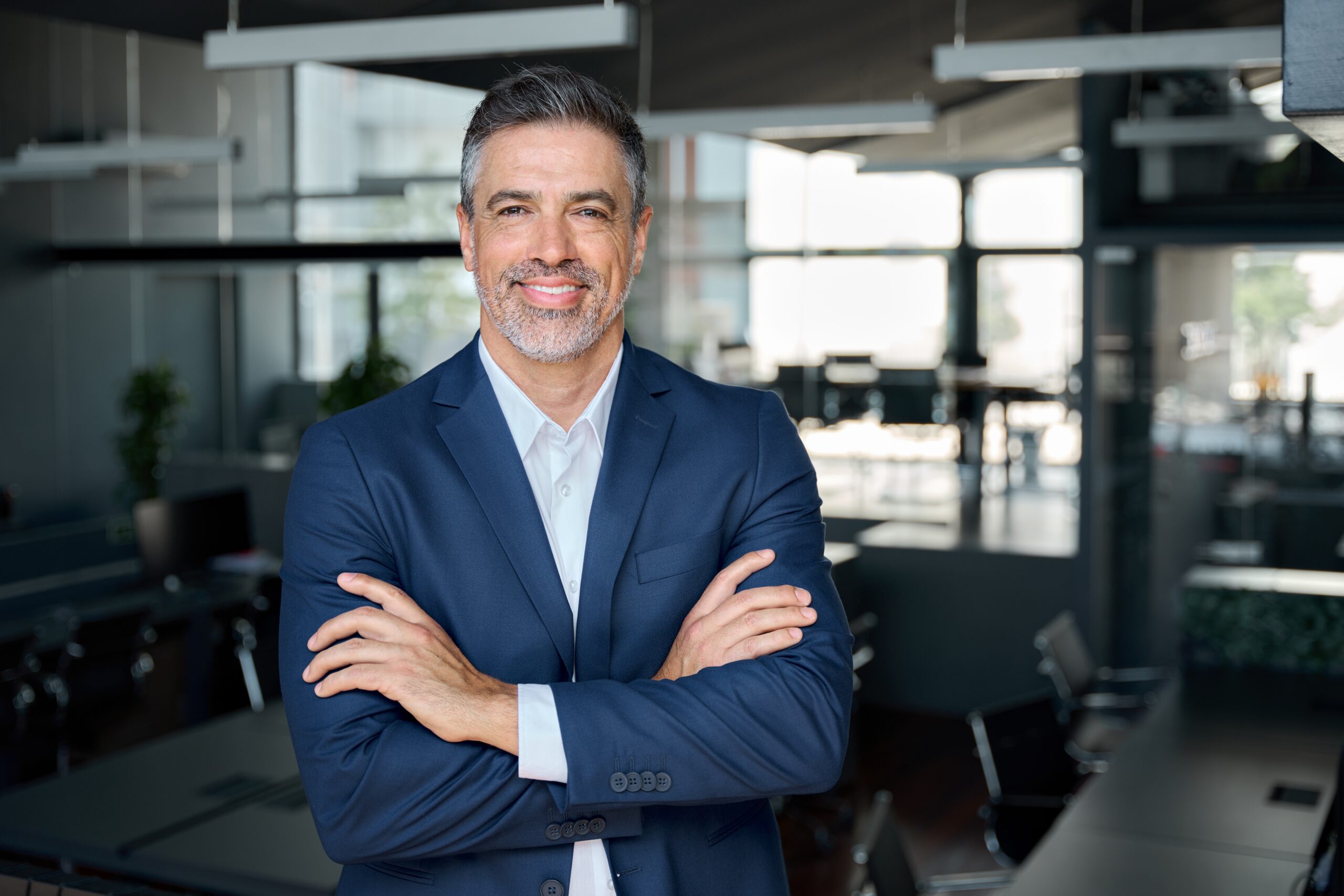 Happy,Middle,Aged,Business,Man,Ceo,Standing,In,Office,Arms